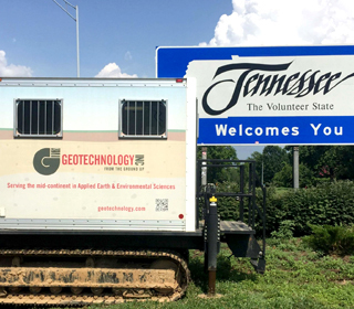Geotechnology CPT rig beside Welcome to Tennessee sign